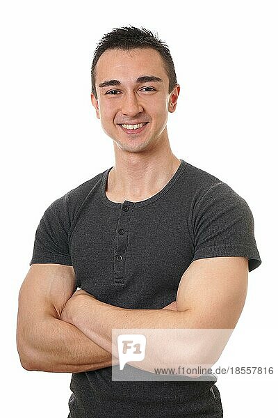 smiling young man with muscular arms folded or crossed isolated on white