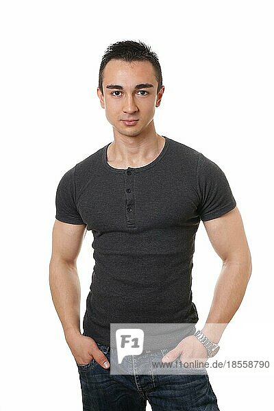 casual young man with muscular arms and hands in pockets