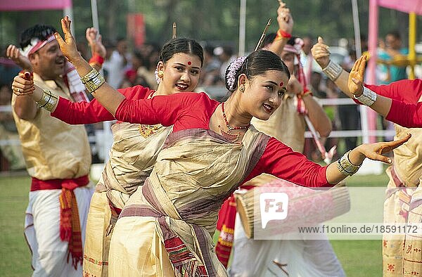 Guwahati  Assam  India. 14 April 2023. Young women in traditional Mekhela Chadar perform Bihu dance  as they celebrates Rongali Bihu festival organized by All Assam Students Union (AASU)  at Judge Field in Guwahati  Assam  India on 14 April 2023