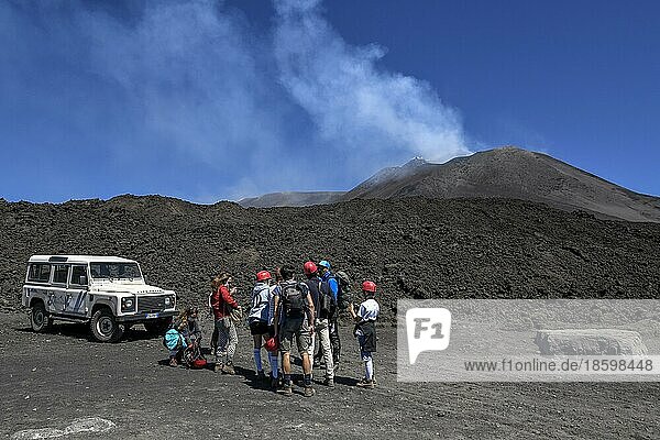 Hikers in the crater landscape of the volcano Etna  summit region  province of Catania  Sicily  Italy  Europe