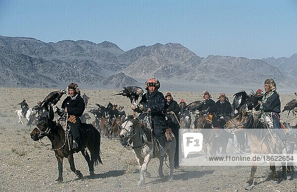 Kazakhs on horseback  participants of the Golden Eagle Festival  Bayan Olgiy Province  Mongolia  Asia