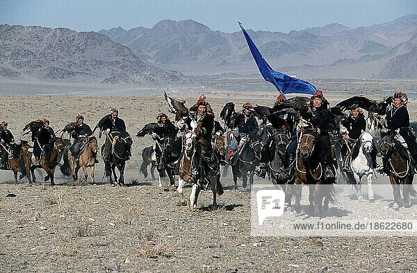 Kazakhs on horseback  participants of the Golden Eagle Festival  Bayan Olgiy Province  Mongolia  Asia