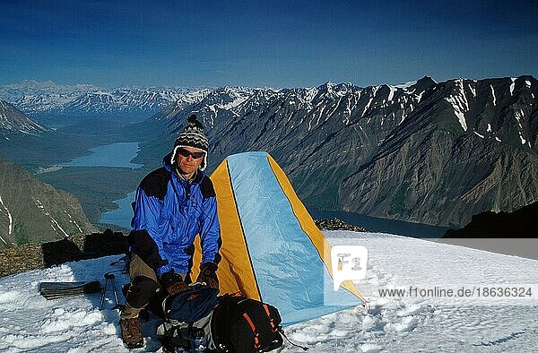 Hiker with tent in the mountains  Kluane National Park  Yukon  Canada  North America