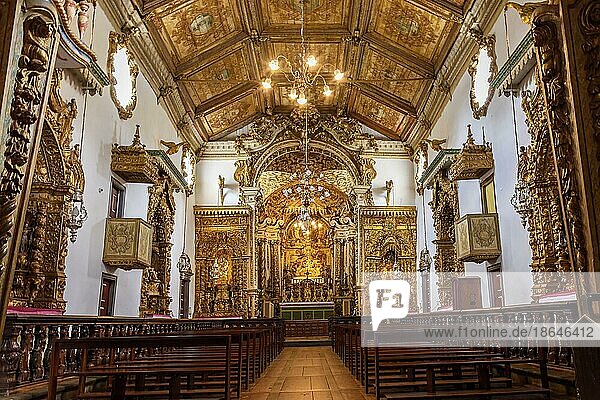 Interior and altar of historic church all painted in gold with baroque architecture in the old city of Tiradentes in Minas Gerais state  Brazil  Brasil  South America
