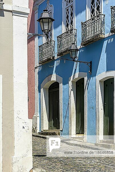 Facades of old colonial style colorful houses on the cobblestone streets and slopes of Pelourinho  Salvador city  Bahia  Brasil