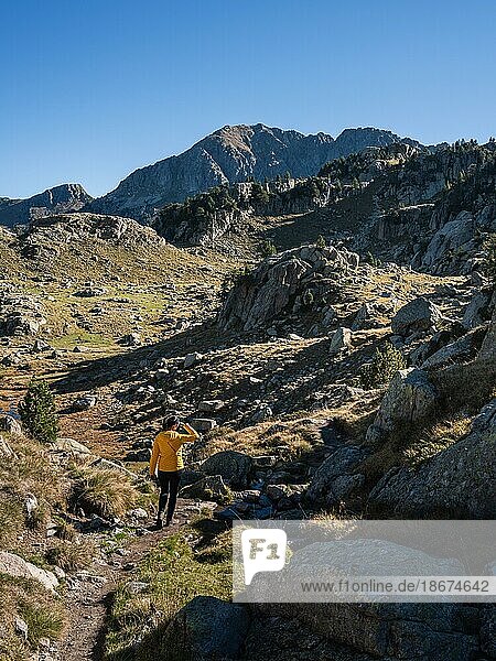 Hiking woman  Circo de Colomers  Pyrenees  Lleida  Spain  Europe