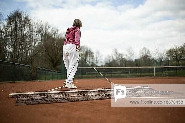 Subject: Woman aged 82 standing on the tennis court.  Dortmund  Germany  Europe