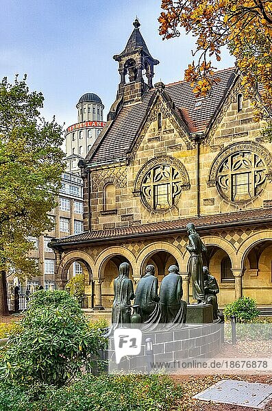 Court of honour with arcades and group sculpture of the Consoling Christ by Selmar Werner. The church  built between 1905 and 1909 in the Striesen district as a hall church  is considered an example of Dresden's reform architecture and combines neo-Romanesque and neo-Gothic elements with those of Art Nouveau  Versöhnungskirche zu Dresden  Saxony  Germany  Europe