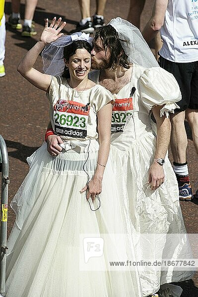 Runners in wedding fancy dress at the Virgin London Marathon Finish on 21.04.2013 at The Mall  London