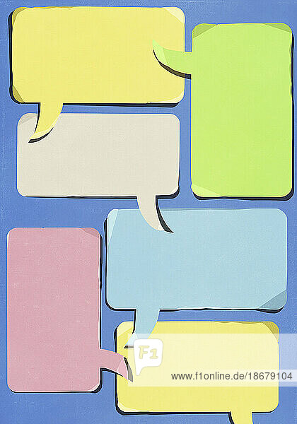 Multicolored communication speech bubbles overlapping on blue background
