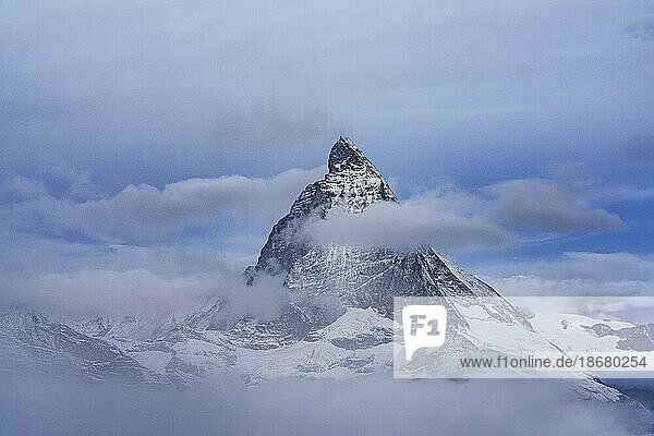Majestic Matterhorn in autumn mist during the blue hour  Gornergrat  Zermatt  canton of Valais  Switzerland  Europe