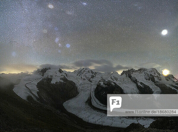 Panoramic of majestic Monte Rosa glacier under the bright stars at night  Gornergrat  Zermatt  canton of Valais  Switzerland  Europe
