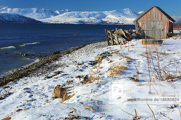 Rorbu and fjord near Sommaroy  Troms og Finnmark  north west Norway  Scandinavia  Europe