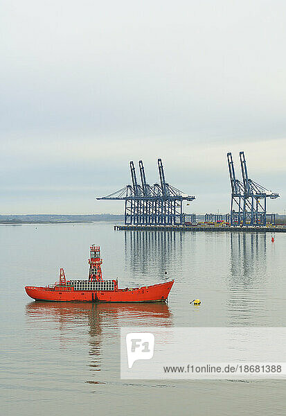 Cranes at Port of Felixstowe and calm sea  UK