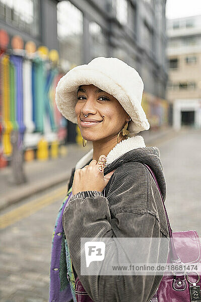 Portrait of hipster young woman in bucket hat