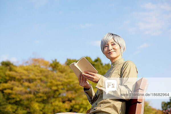 Senior Japanese woman at a city park