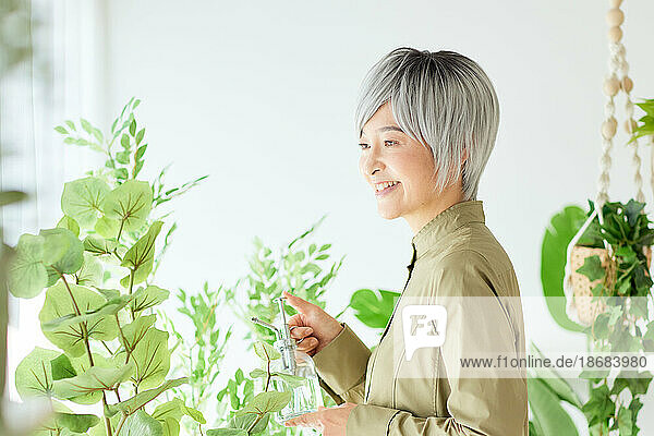 Senior Japanese woman gardening