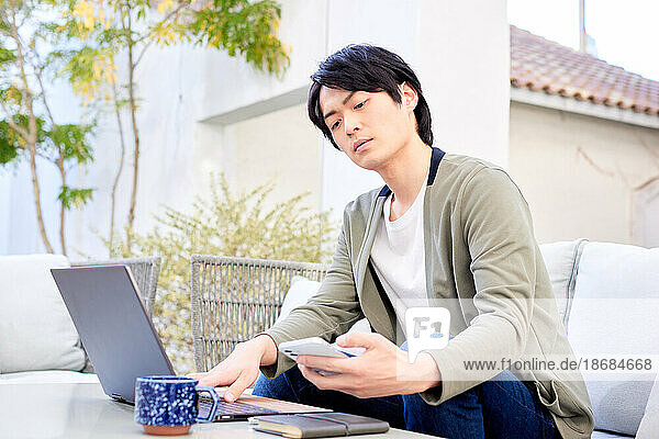 Japanese man working on laptop