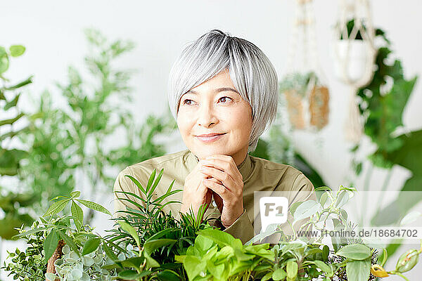 Senior Japanese woman gardening