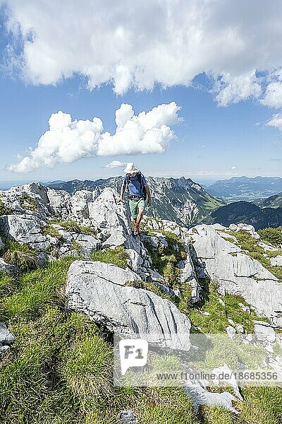 Climber on a rocky ridge  traversing the Hackenköpfe  ridge path  Kaisergebirge  Wilder Kaiser  Kitzbühler Alps  Tyrol  Austria  Europe