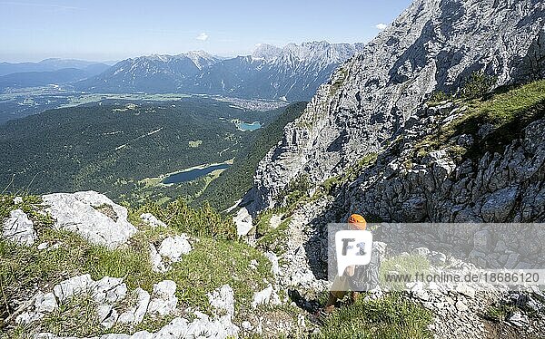 Mountaineers climbing the Obere Wettersteinspitze  behind Ferchensee  Wetterstein Mountains  Bavarian Alps  Bavaria  Germany  Europe