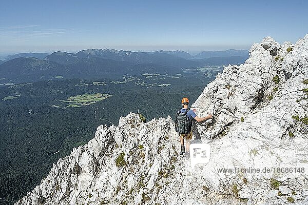Mountaineers climbing to the Upper Wettersteinspitze  behind Ferchensee and Karwendel Mountains  Wetterstein Mountains  Bavarian Alps  Bavaria  Germany  Europe