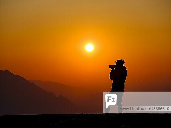Silhouette of a photographer at sunset  Trattberg  Bad Vigaun  Land Salzburg  Austria  Europe