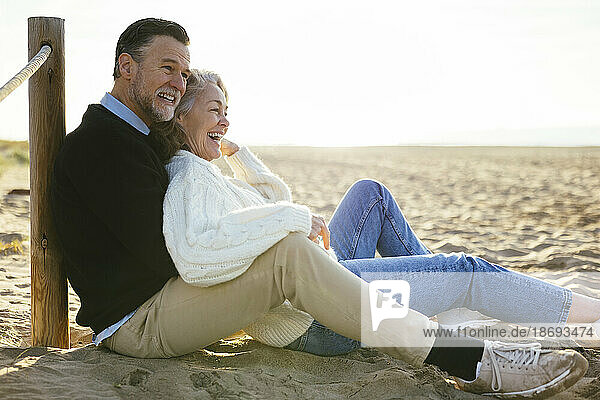 Happy mature couple enjoying together at beach