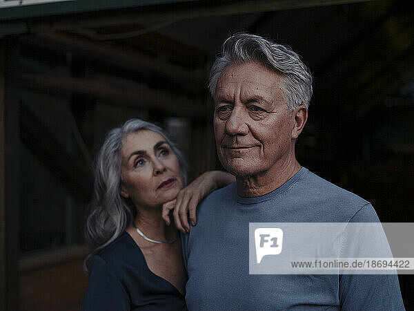 Portrait of mature woman looking at senior husband