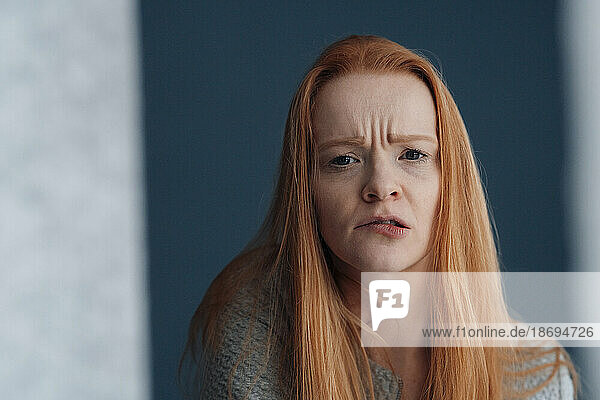 Redhead woman making facial expression