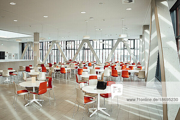 Chairs and tables arranged in modern cafeteria