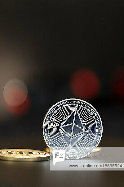 Close-up of silver colored Ethereum coin