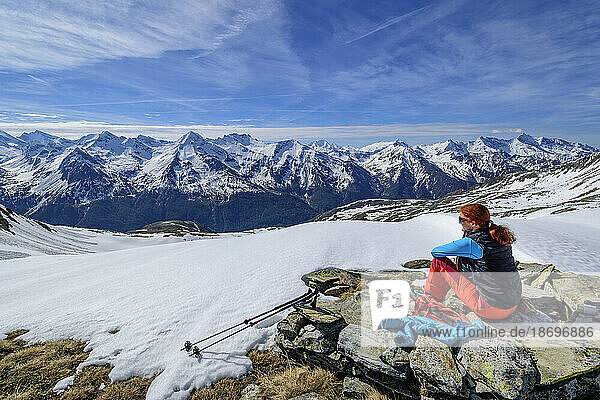 Austria  Tyrol  Female skier taking break at Hundskehljoch pass