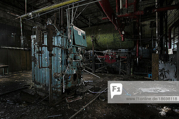 Machinery and debris in an abandoned elastic factory; Centrelea  Nova Scotia  Canada