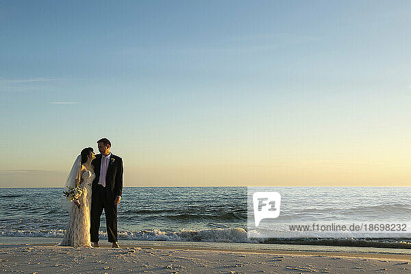 Bride and groom on a beach in Florida; Panama City Beach  Florida  United States of America