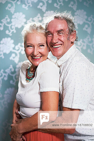 Portrait happy  carefree senior couple hugging