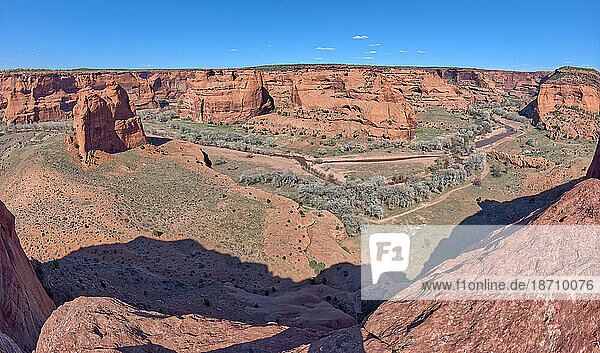 Panorama view of the Junction between the north and south forks of Canyon De Chelly National Monument  with Dog Rock rock formation on the far left  Arizona  United States of America  North America