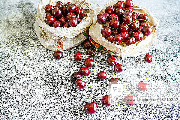 Fresh ripe cherries on a table at springtime  Italy  Europe