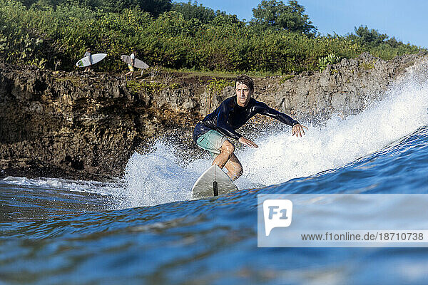 Surfer in sea  Jimbaran  Bali  Indonesia
