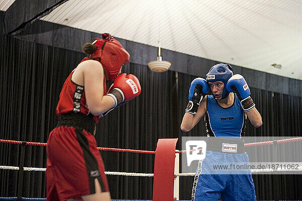 A female boxer stares at her opponent during the semi-final match at the Canadian Amateur Boxing Championships in Saint-Hyacinthe  Quebec.