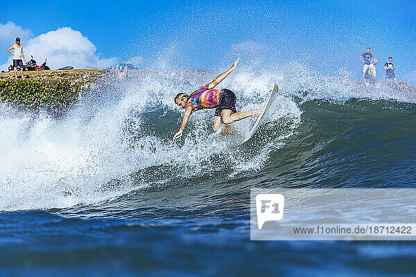 Surfer riding wave in sea  Jimbaran  Bali  Indonesia
