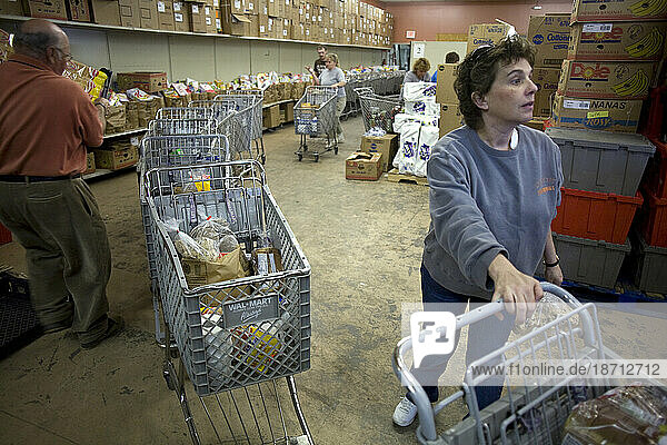 Volunteers line up carts of food for the needy in Morganton NC.