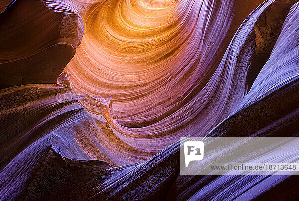 Patterns in the sandstone walls of an Arizona Slot Canyon come alive with color through the use of reflected light.
