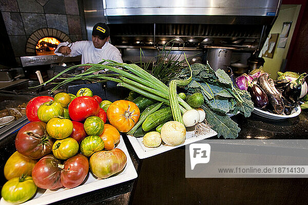 Restaurant staff preparing the evening's menu using organic produce.