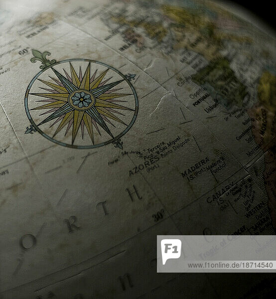 The compass of a map is pictured