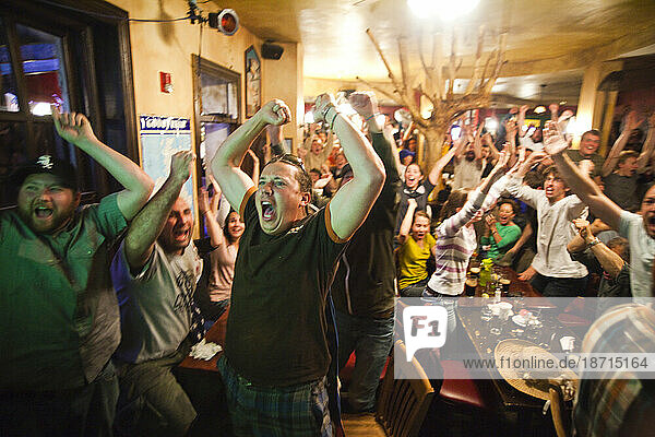 Crowds of spectators watch the World Cup match between England and the USA at a pub in Boulder  Colorado.
