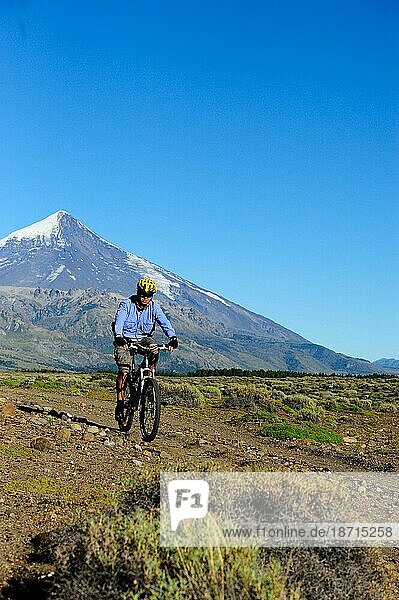 Young guy mountain biking in the mountains of Patagonia