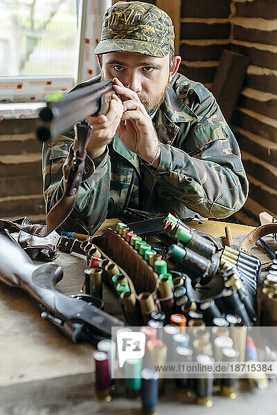 Front view of man checking shotgun sight  Tikhvin  Saint Petersburg  Russia