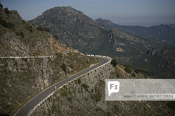 A road in the mountains of Sierra de Grazalema National Park  Cadiz province  Andalusia  Spain.
