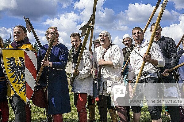 Re-enactors Pose With Weapons At A Festival Of Medieval Culture In Russia